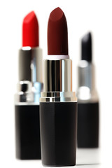 Obraz premium Set of color lipsticks. Red lipstick, black lipstick, wine lipstick