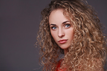 Fototapeta premium Portrait of woman with curly hair