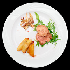 Delicious chianina beef dish isolated on black