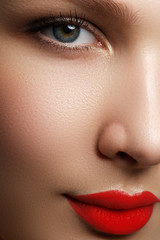 Naklejka premium Beautiful blonde model woman face with blue eyes and perfect make-up