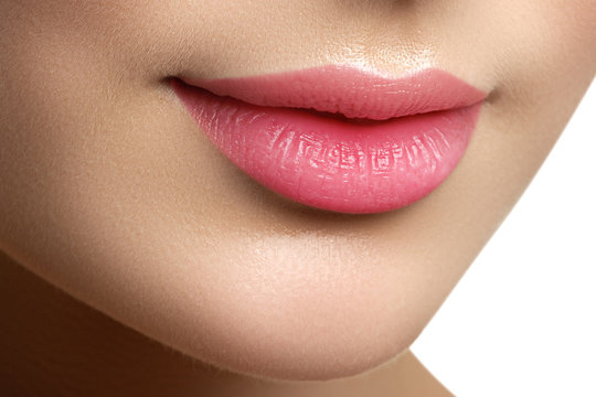 Perfect smile. Beautiful full pink lips. Pink lipstick. Gloss lips