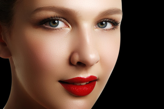 Portrait of elegant woman with red lips. Beautiful young model