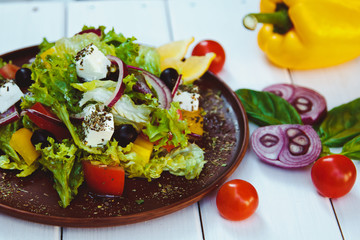 Beautiful fresh vegetable salad on wooden table