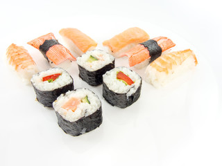 assorted delicious japanese traditional sushi over white