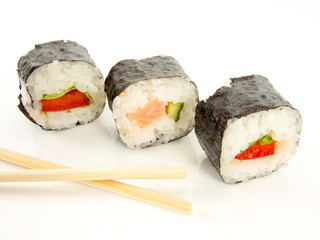 assorted delicious japanese traditional sushi over white