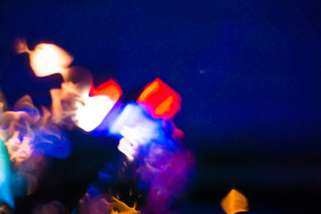 Abstract color background with bokeh lights inside from car