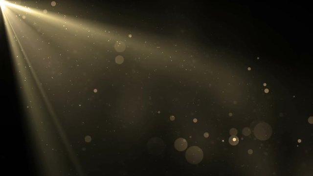 Moving gloss particles on gold background. Flood lights disco background with rays and particles.  Beautiful disco background. Seamless loop.