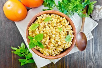 Barley porridge with basil on board top