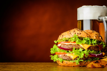 Burger and Mug of Cold Beer with Copy Space