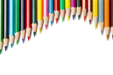 colored pencils lying wave on the top. isolated on white background 