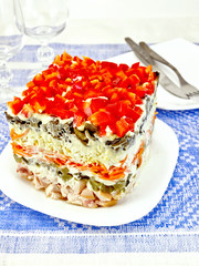 Salad with chicken and peppers on tablecloth