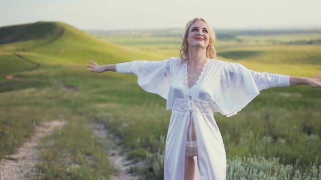 woman spinning and smiling in the Meadow