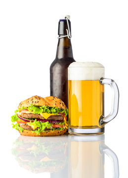 Burger with Bottle and Mug of Cold Beer on White
