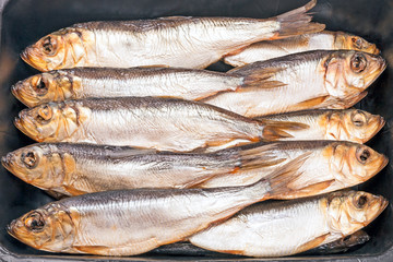 Fish on a black tray
