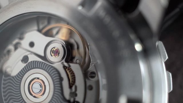 Swiss made watch movement in action. Macro shot