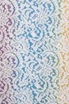 white lace fabric with floral pattern on colorful background