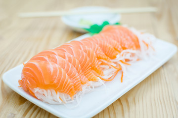 Fresh salmon slice on wooden table