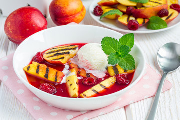 Cold fruit soup with raspberry, grilled nectarines and ice cream
