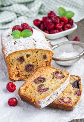 Sliced banana bread with raspberries, cherries and white chocolate