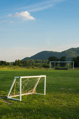 Mini and big soccer goal in the field. Selective Focus.