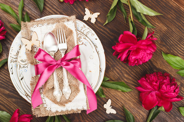 Tableware and silverware with peonies