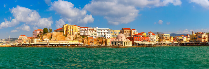 Panoramic view of old harbour of Chania with Venetian quay and Kucuk Hasan Pasha Mosque in the sunny morning, Crete, Greece