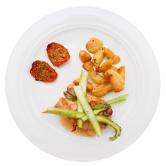 White meat and vegetables on plate, isolated