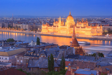 Fototapeta na wymiar View of Parliament Building illuminated at dusk, Budapest, Hungary