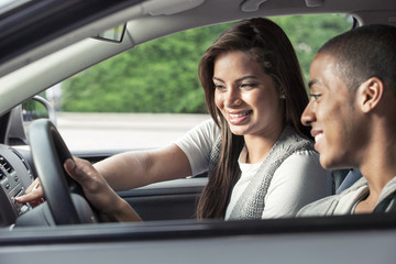 Teenagers driving car