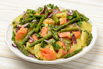 Delicious salad wit green asparagus, smoked salmon and potatoes.