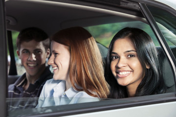 Teenagers riding in car