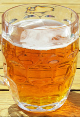 
Glass of yellow beer in the sunlight

