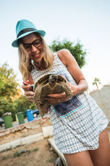 woman feeding turtle