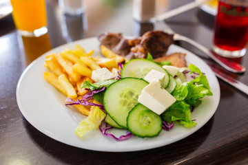 Fish and chips with salad on the plate