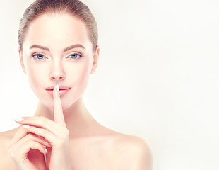 Beautiful Young Woman with Clean Fresh Skin close up . Skin care face . Cosmetology