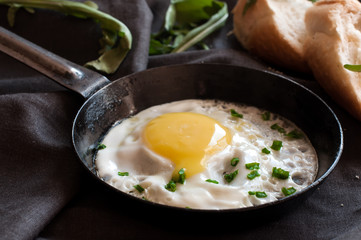 Fried egg in frying pan with bow