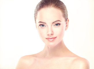 Beautiful Young Woman with Clean Fresh Skin close up . Skin care face . Cosmetology