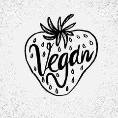 Hand drawn strawberry with text Vegan on grunge background. Heal