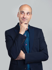 handsome bald man thinking