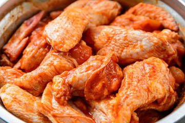 Raw spiced Chicken Wings before cokking