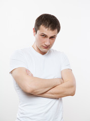 Obraz premium Wary young man looking at camera