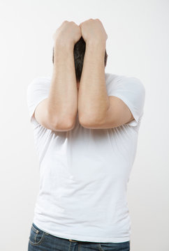 Young man closing his face
