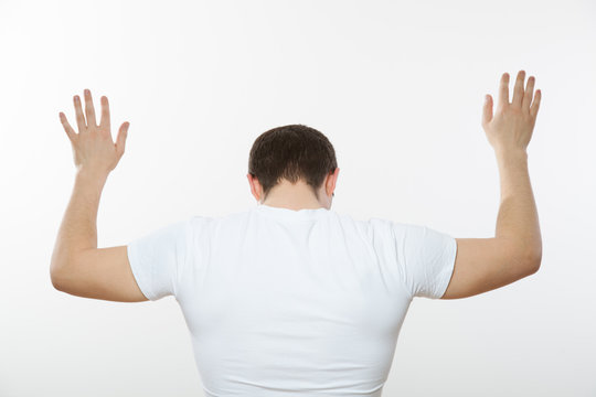 Young man turning back and capitulating