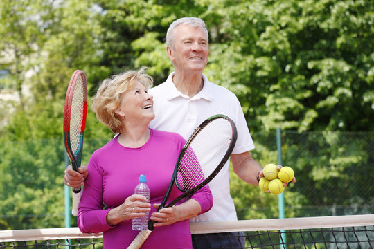 Seniors playing tennis