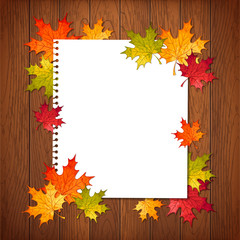 Naklejka na ściany i meble Autumn background with maple leaves and paper sheet