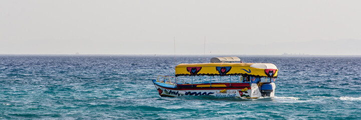 Glass boats sailing at the coast of Aqaba in Jordan.
