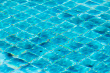 Swimming pool with sunny reflections