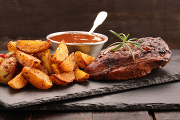 Grilled chicken with baked potatoes and dip