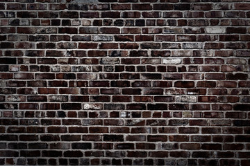Fototapeta na wymiar brick wall. brick wall of red color, wide panorama of masonry.Old Red Brick Wall with Sunlight and Shadows. Weathered texture of stained old dark brown and red brick wall background, blocks of stone.
