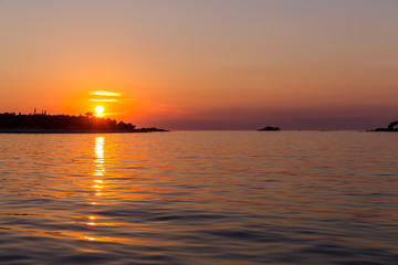 Fototapeta na wymiar Sea sunset with ship trace